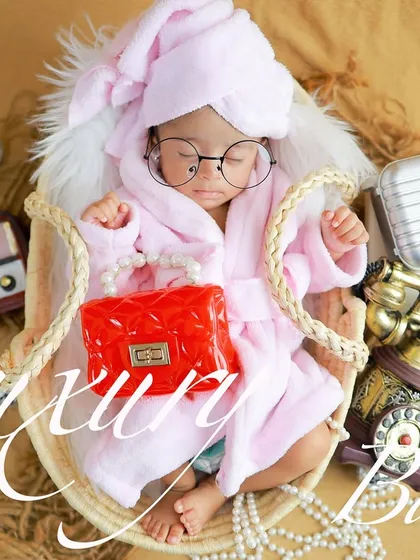 A little bit of pampering for this luxury baby. This fun, spa-day theme with a tiny bathrobe, glasses, and retro props is perfect for a baby with style.