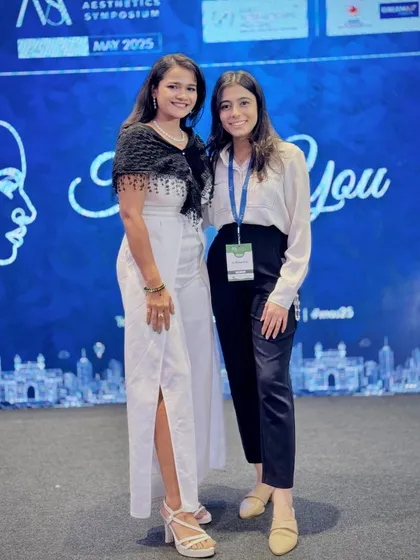 Posing with one of the event organizers at the Medical Aesthetics Symposium. Collaboration is key to a successful event.
