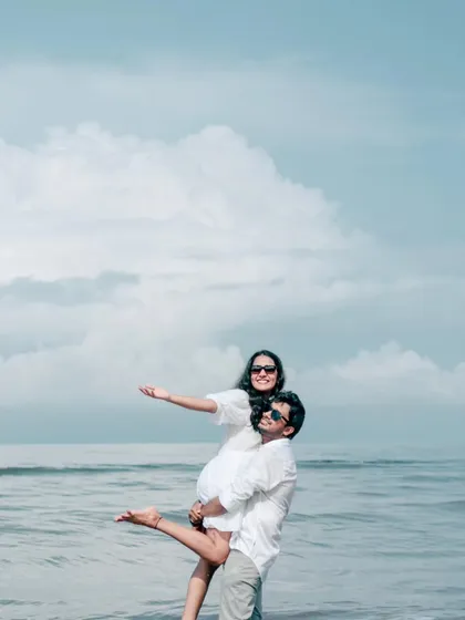 There's nothing like the playful energy of a beach pre-wedding shoot. This shot captures a moment of fun and freedom, with the sea and sky creating a beautiful, natural backdrop for your love story.
