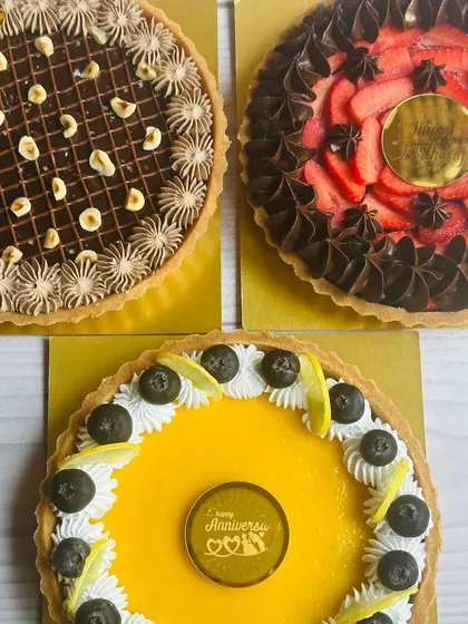 A trio of my irresistible tarts, showcasing the variety I offer. This image features my Nutella Hazelnut, Choco Strawberry, and Lemon Blueberry tarts.