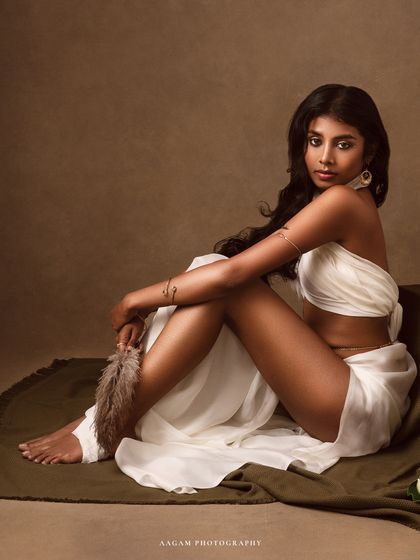 Grace, timelessness, and a moment that lingers forever. This portrait, with the subject draped in white, has the feel of a classical sculpture.