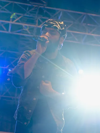 The hustle is real, but the dream is always worth it. This photo was taken during a big festival performance, capturing the energy and passion that goes into every show. It's a reminder of the journey from writing songs in my room to playing under the big lights.