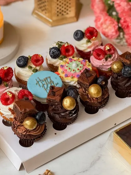A closer look at the Rakhi mini cupcakes, showing the detailed toppings and vibrant colors. Each cupcake is a little burst of flavor and joy.