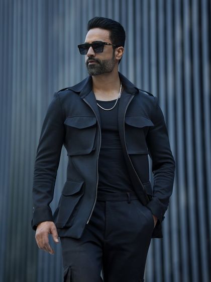 Our GT Tracksuit in black, featuring a stylish four-pocket jacket. This is not your average tracksuit; it's a statement in luxury casual wear.