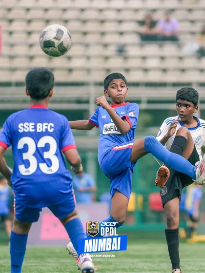 An action shot of two players competing for an aerial ball.