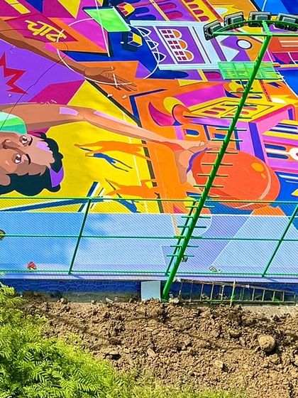 This part of the mural depicts the energy of Mumbai, with its iconic architecture and the spirit of the game. The colors are bold and electric, reflecting the city's vibe.