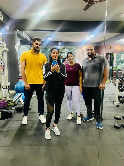 A group selfie in the mirror. Our gym is filled with inspiring individuals who are all on their own unique fitness journeys.