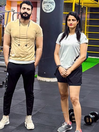 The grind doesn't lie. Standing with a client who has put in the work and is seeing the results.