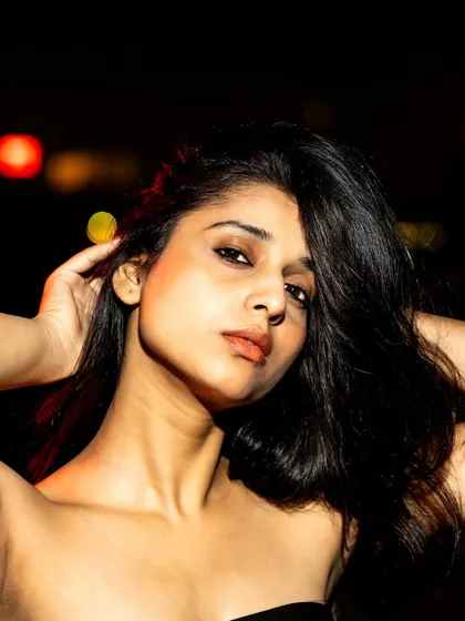 A beautiful close-up beauty shot. The flash provides a clean, crisp light that highlights her features perfectly.