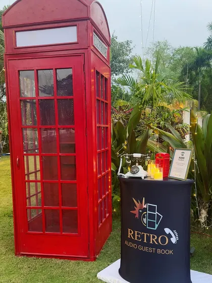 My classic red British-style phone booth is always a hit. This complete setup includes the iconic booth, a separate podium, and a vintage phone, creating a fun, nostalgic experience for your guests at any wedding or party.