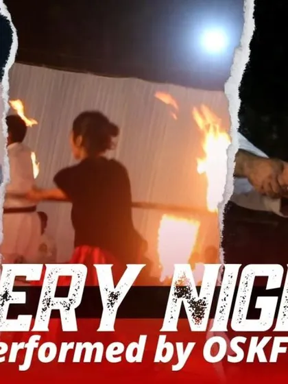 A glimpse from our "Fiery Night" demonstration. Advanced Kobudo training involves incredible displays of skill and control, including performances with fire that showcase the highest levels of mastery.