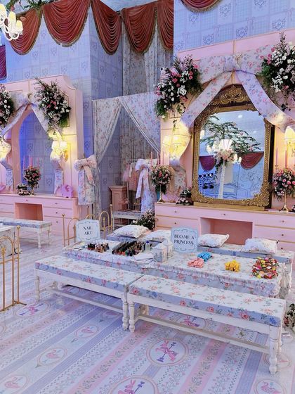 A wider view of the princess pamper station, showing the level of detail in the custom furniture and floral decor.