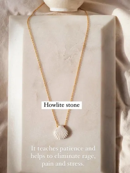 This howlite shell pendant teaches patience and helps to eliminate rage, pain, and stress. It's a powerful calming stone.