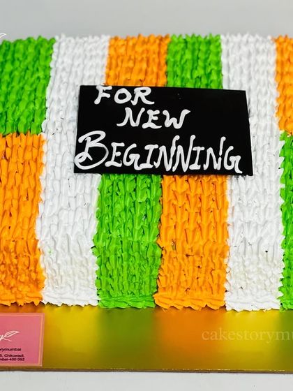 A cake to celebrate Republic Day. The frosting is piped to resemble the Indian tricolor flag, perfect for national holidays or celebrating new beginnings.