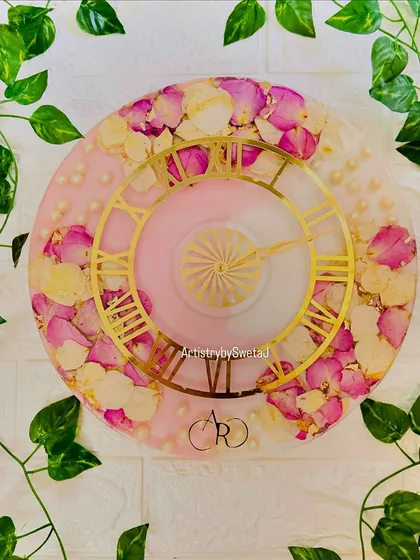 Sometimes, beauty is its own memory. I created this floral clock by preserving delicate rose petals from a special bouquet in soft pink resin, accented with pearls and a classic golden dial. It’s a functional piece of art that makes time feel a little more beautiful.
