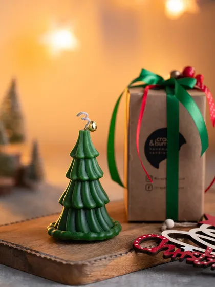 My Christmas tree candle is a hot favorite. Here it is, beautifully packaged and ready to be gifted, with its little bell on top adding a touch of magic.