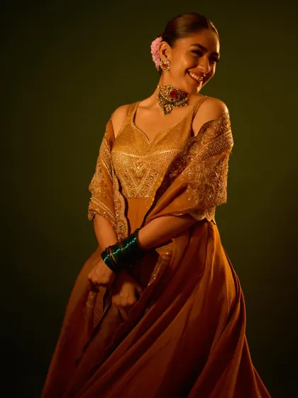 A playful and happy moment during the shoot, showcasing the beautiful drape of the dupatta.