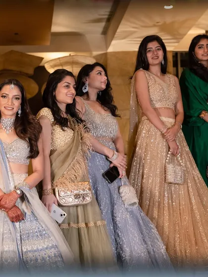 More happy guests at the wedding, showcasing the elegant attire and the celebratory atmosphere we help create.