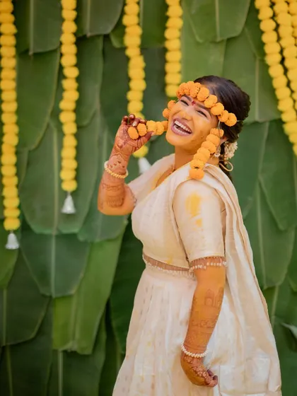 The pure, unadulterated fun of a Haldi ceremony. I love capturing the laughter and vibrant colors of this tradition, showing the bride enjoying the moment with her loved ones.
