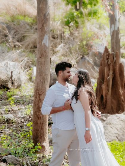 A walk in the woods becomes a romantic escape. I love using the soft, natural light filtering through the trees to create serene and intimate couple portraits.