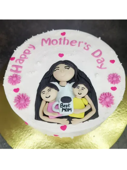 A lovely Mother's Day cake with a fresh mango flavor. The handmade fondant topper shows a mother being hugged by her two children.