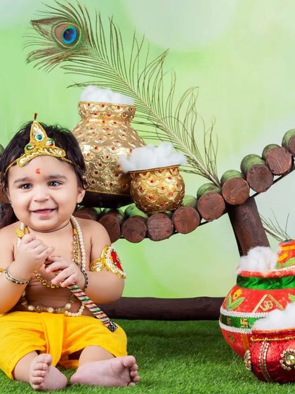 This little Kanha is all smiles with his flute and pots of butter. The vibrant colors and happy expression make this a favorite.