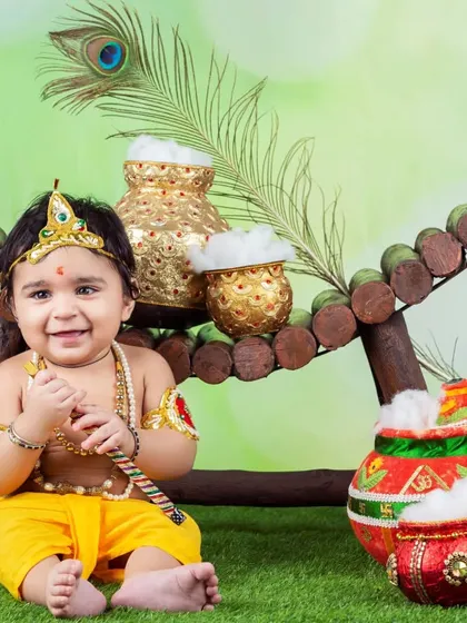 This little Kanha is all smiles with his flute and pots of butter. The vibrant colors and happy expression make this a favorite.