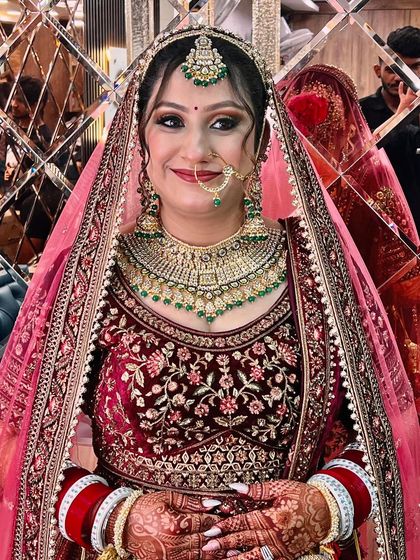 A happy smile from our bride, fully ready for her big moment. Her confidence shines through, showing the power of a perfect bridal makeover.