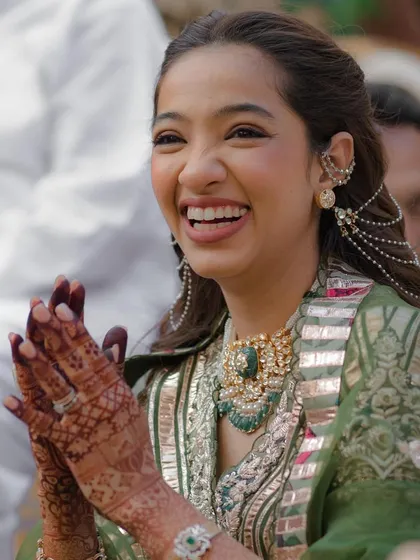 Another joyful shot of the bride, her smile as bright as her beautiful hairstyle.