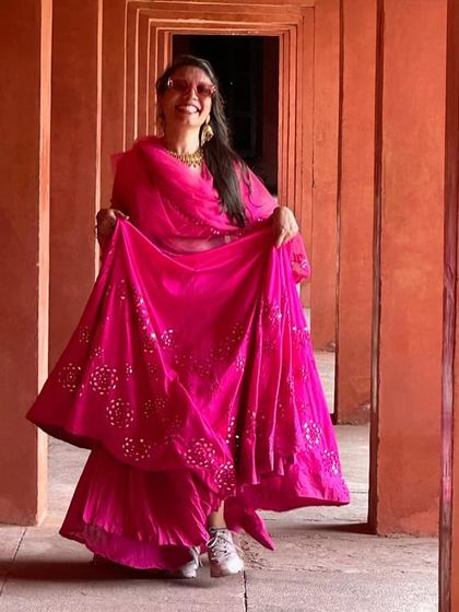 Can't wait for your big day? Run towards your best life in style with this rani pink mirror work lehenga.