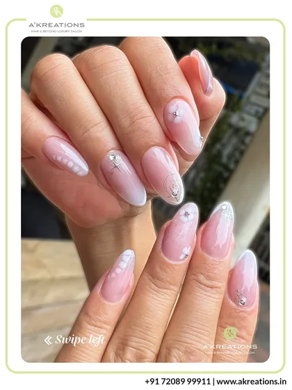 For a touch of timeless sophistication, we design elegant nail sets featuring a soft white ombre base, delicate patterns, and carefully placed rhinestone accents.