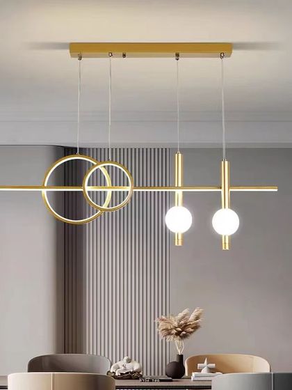 A linear pendant with intersecting rings and globes, installed in a client's modern office. It's a perfect blend of form and function.