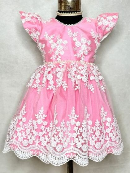 Our popular "Arya" dress in a vibrant Barbie pink. The delicate white floral lace overlay creates a beautiful contrast, making it a sweet and classic choice for parties and photoshoots.