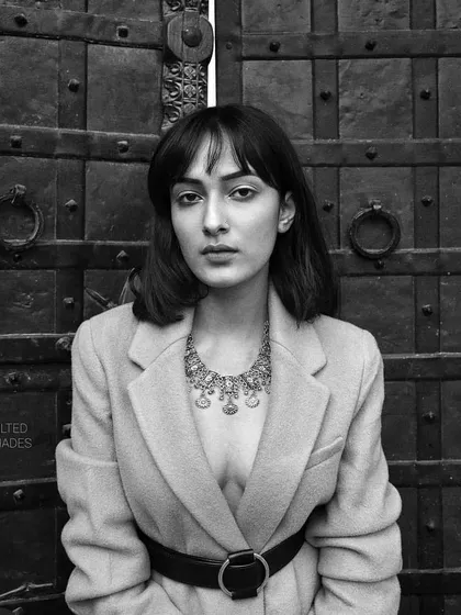 A striking black and white portrait with a modern, edgy feel. I kept the makeup minimal and clean, with a focus on perfect skin and defined brows to complement the sharp styling.