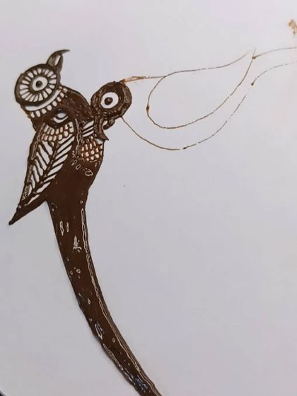 The parrot motif in progress. Here you can see the shading and line work that gives the bird its form and texture.