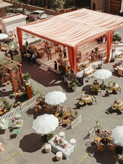 I love designing immersive, experiential events that tell a story. This aerial view shows a Parisian Market-themed Mehendi, where every corner offered a new activity, from live pottery to DIY potpourri, creating a truly engaging celebration.