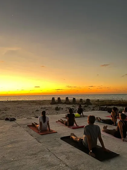 Sunset Hatha yoga on a helipad in Lakshadweep. We believe in practicing in extraordinary places, allowing the beauty of nature to deepen our connection to the practice and ourselves.