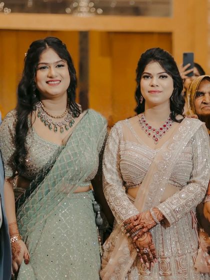 Two clients ready for a party. This shows my ability to create coordinated yet individual looks for groups.