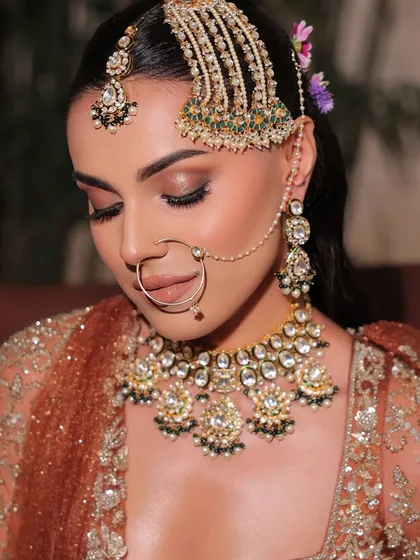 A serene, eyes-closed shot showing the detail of the soft brown smokey eye. This is a versatile look that suits many different occasions.