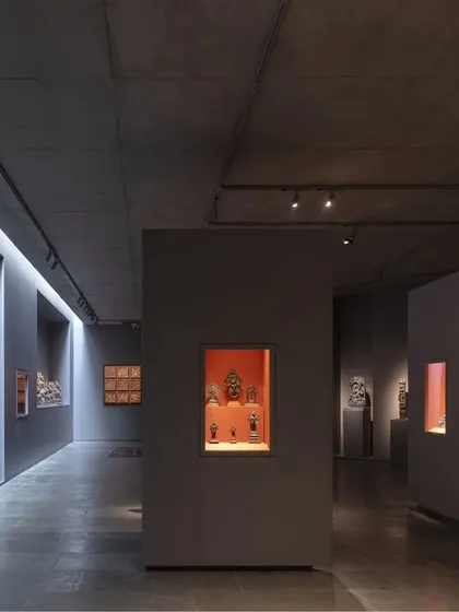 The experience of art is shaped by its environment. In the Vismaya private museum, we manipulated form and light to create dramatic, atmospheric galleries, using focused illumination and dark, monolithic partitions to highlight individual artifacts and guide the visitor's journey.