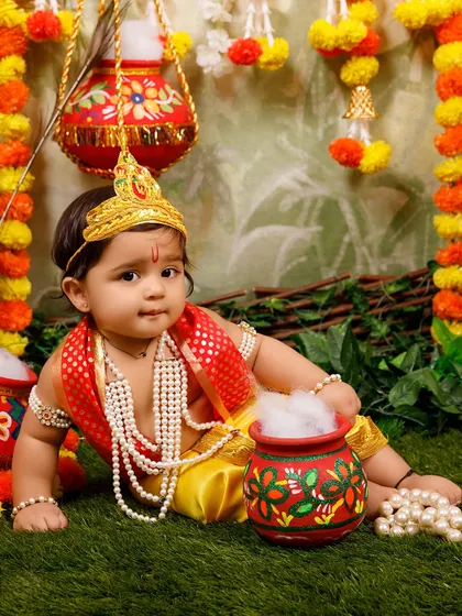 An example of a baby boy dressed as Krishna, showcasing one of the poses and outfits for the Janmashtami shoot.