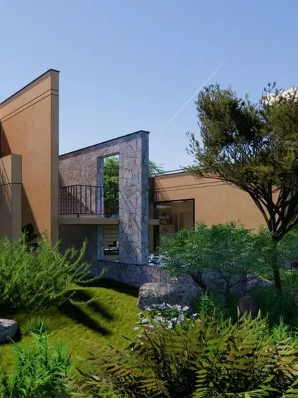 Our Earth Abode farmhouse project in Shoolagiri is a testament to environmentally responsible design. We used poured earth walls and locally sourced stone to create a structure that blends seamlessly into the landscape, prioritizing nature and well-being.