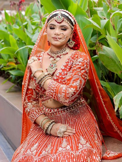 A serene moment captured. The highlighter on the cheekbones gives a beautiful glow, perfect for wedding photography.