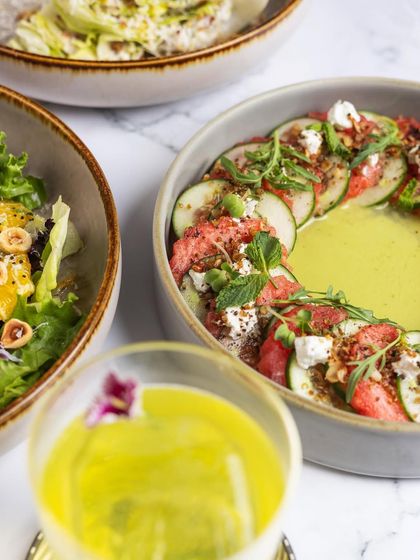 A closer look at our Watermelon and Cucumber salad, a refreshing and beautifully plated dish.