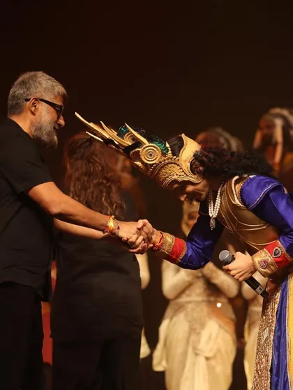A moment of gratitude on stage, shaking hands with Vivek Agnihotri after a performance. His appreciation for our work is a great source of motivation for me and my team.