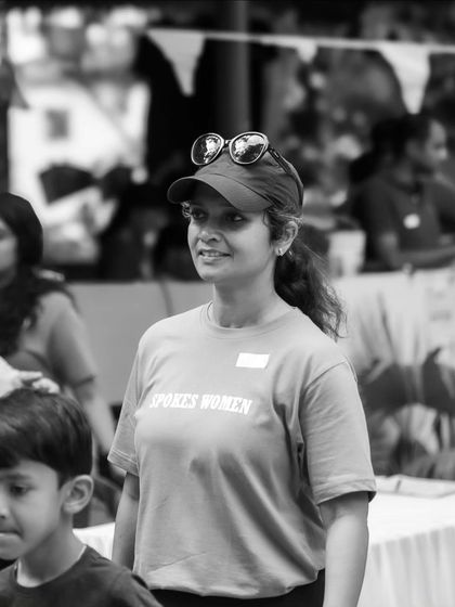 A volunteer looking on at the event, sporting the grey 'Spokes Women' tee. It's a classic and comfortable choice for our members.