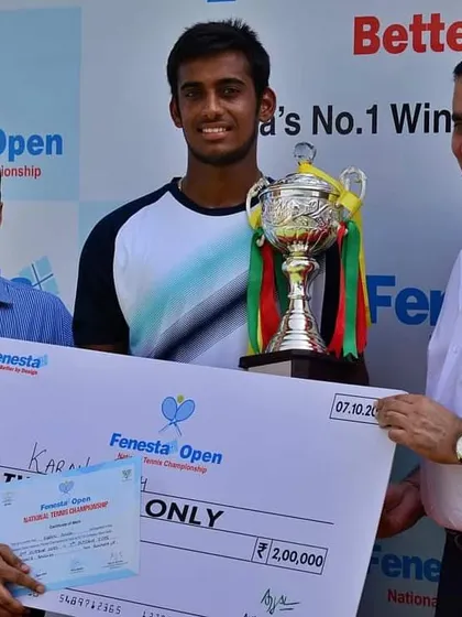 NTC's Karan Singh receiving his finalist prize money and trophy after a spectacular run in the Fenesta Nationals Men's Singles.