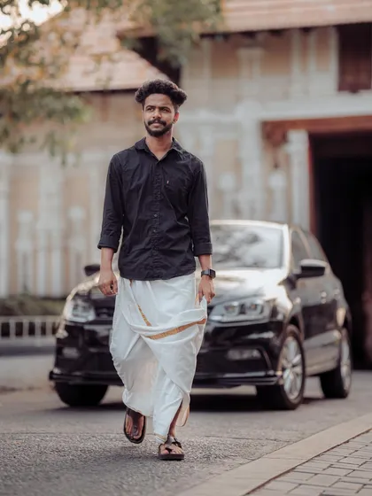 A modern take on a traditional look, this men's portrait combines classic Kerala attire with a contemporary, confident attitude. I aim to capture authentic personality in every men's portraiture session.