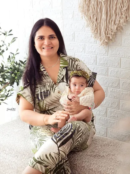 A mother's love shines in this photo as she holds her baby girl. The soft, natural styling of this session creates a warm and relaxed feel.