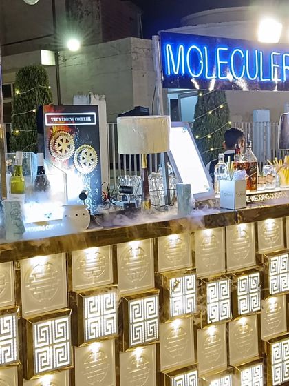 Another angle of the Greek key patterned bar, showing the dry ice effect and the full range of spirits available.